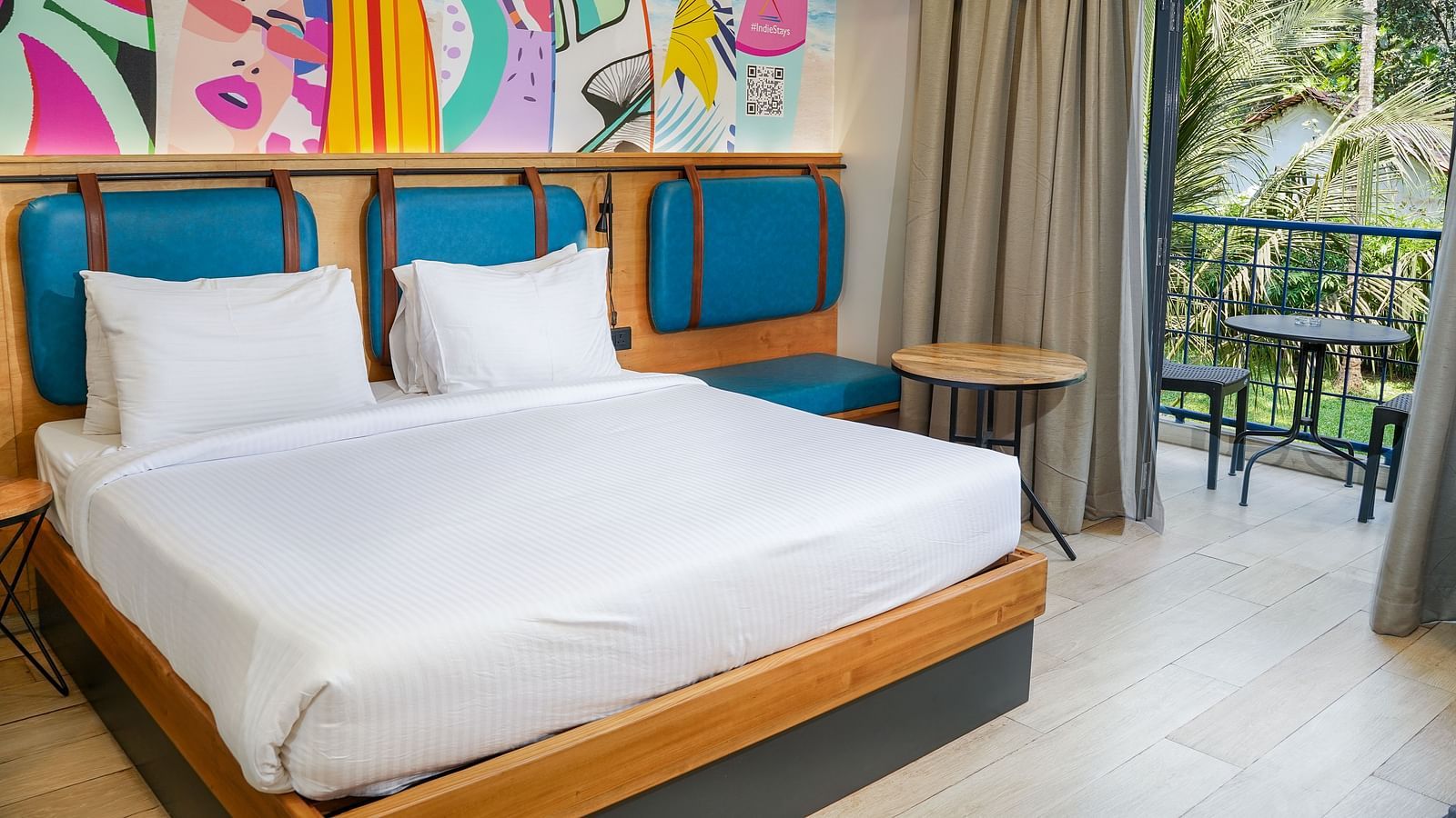 A large bed in Cozy Double Room at Indie Stays Resort, Goa.